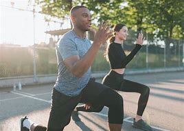 Physical Exercise (Physical Wellbeing): A man and woman exercising outdoors, demonstrating physical activity and fitness.
