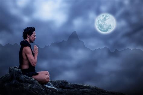 Meditation (Spiritual Wellbeing): A man meditating under the night sky with the full moon, symbolizing spiritual well-being and inner peace.